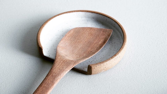 A circular spoonrest with a linear slice cut off the bottom for placing your spoon.