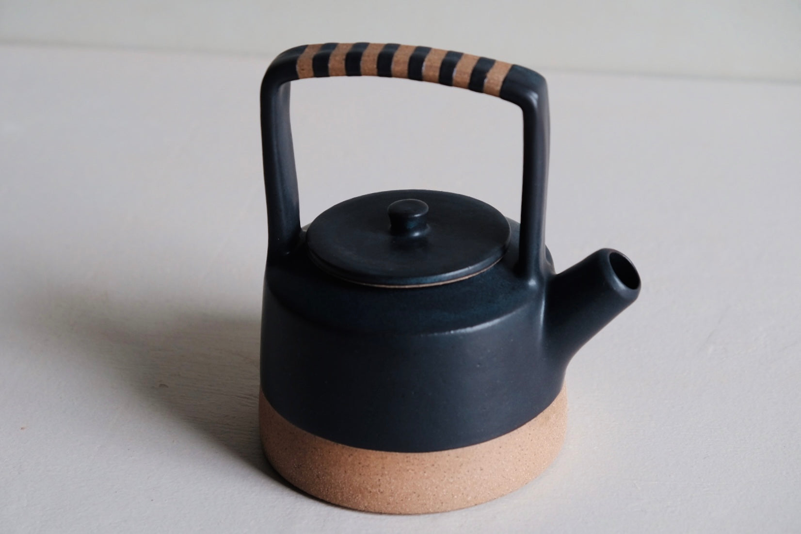 Black and White Stout Tea Kettle with Iron Handle