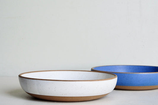 A medium serving dish that's dipped fully in a blue sky-blue glaze.